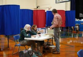 people check in at the polls before heading into the voting booths