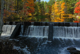 pickpocket dam in the fall with water flowing over the falls