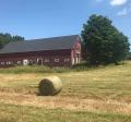 Image of barn with hay bale