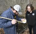 Health Officer Madison Bailey and Northeast Vegetation & Mosquito Control look at mosquito larvae