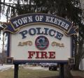 photo of sign reading Town of Exeter Police and Fire in front of the public safety complex