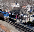 The downeaster train stopped at the Exeter Train Platform as passengers wait to get on the train