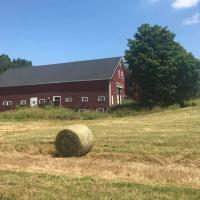 Image of barn with hay bale