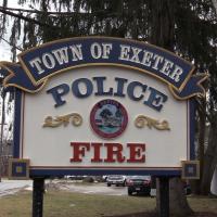 Photo of the Police and Fire sign at the public safety complex reading Town of Exeter Police and Fire