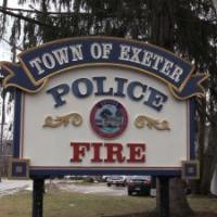 sign reading Town of Exeter Police and Fire