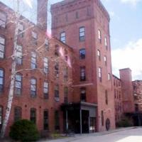 A large brick building located on 156 Front Street
