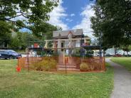 Founders Park Sculpture behind orange fence is being renovated