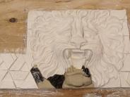 lion panel being sculpted