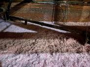 new pink insulation lines the attic floor of town hall