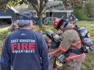 fire fighters setting up equipment