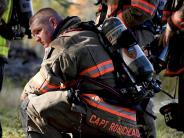 a fire fighter sits down