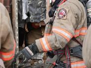 a firefighter points at equipment