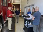 Fire Department staff inspect the vehicle