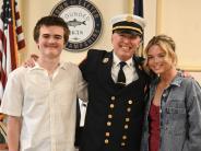 New Fire Chief Justin Pizon in the Nowak Room with family