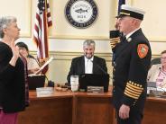 New Fire Chief Justin Pizon being sworn in by Town Clerk Andie Kohler