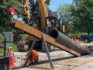 Workers constructing the "driving beam"