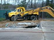 Cement is being removed from the future spray pad area 