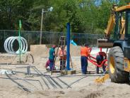 Workers are installing the water fixtures 