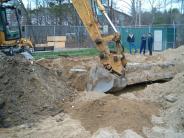 A crane is used to remove the old Tot Pool 