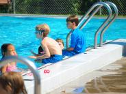 people relaxing in a pool