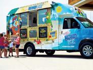Kona Ice truck with kids getting snow cones
