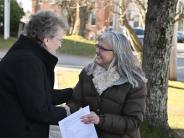 Mrs. Webb and Pam McElroy shake hands