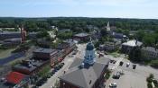 An aerial photograph looking over the Town Hall towards downtown Exeter