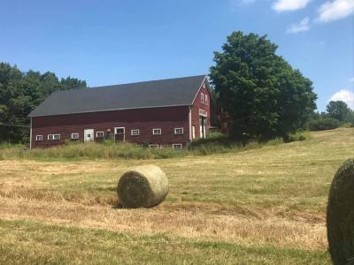 Image of barn with hay bale