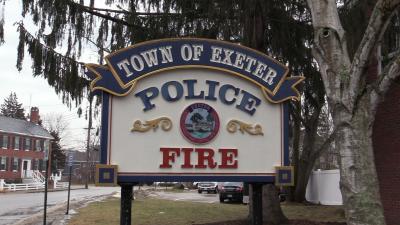 Photo of the Police and Fire sign at the public safety complex reading Town of Exeter Police and Fire