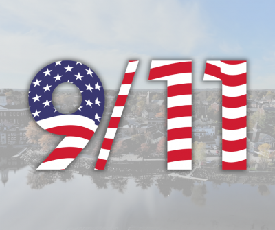 aerial photo of Exeter's waterfront with the "9/11" written in font colored in to look like the American flag