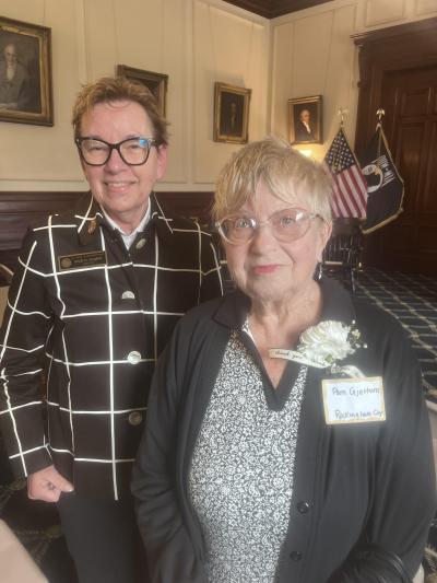Julie Gilman left stands with Pam Gjettum right