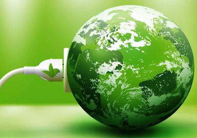a white electric plug going into a green shaded earth globe with green background