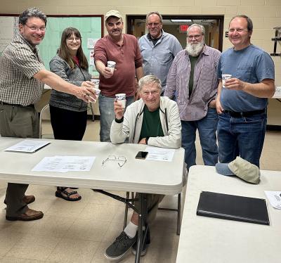 Members of the Exeter-Squamscott River Local Advisory Committee raise a toast to Don Clement in celebration of Don being awarded