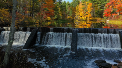 pickpocket dam in the fall with water flowing over the falls