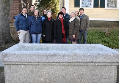 Mrs. Webb and family stand with Selectwoman Julie Gilman and Senior Executive Assistant Pam McElroy in front of the trough